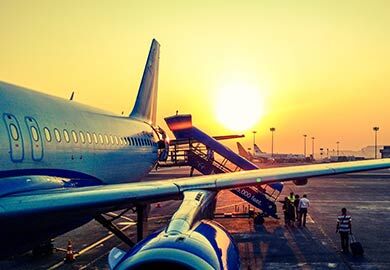 Aeroplane with the sun setting behind it